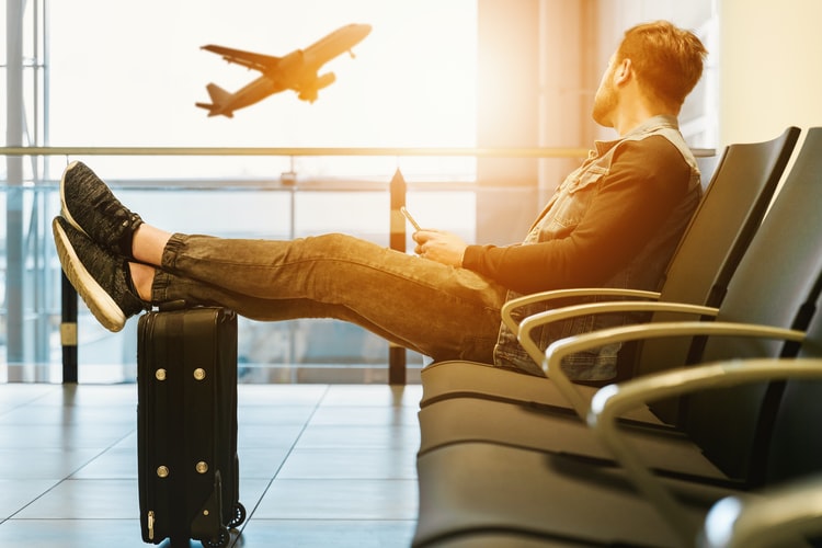 man sitting at an airport
